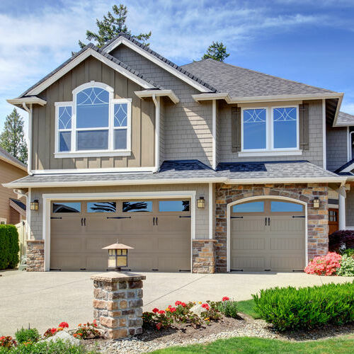 Home exterior with garage and driveway. 